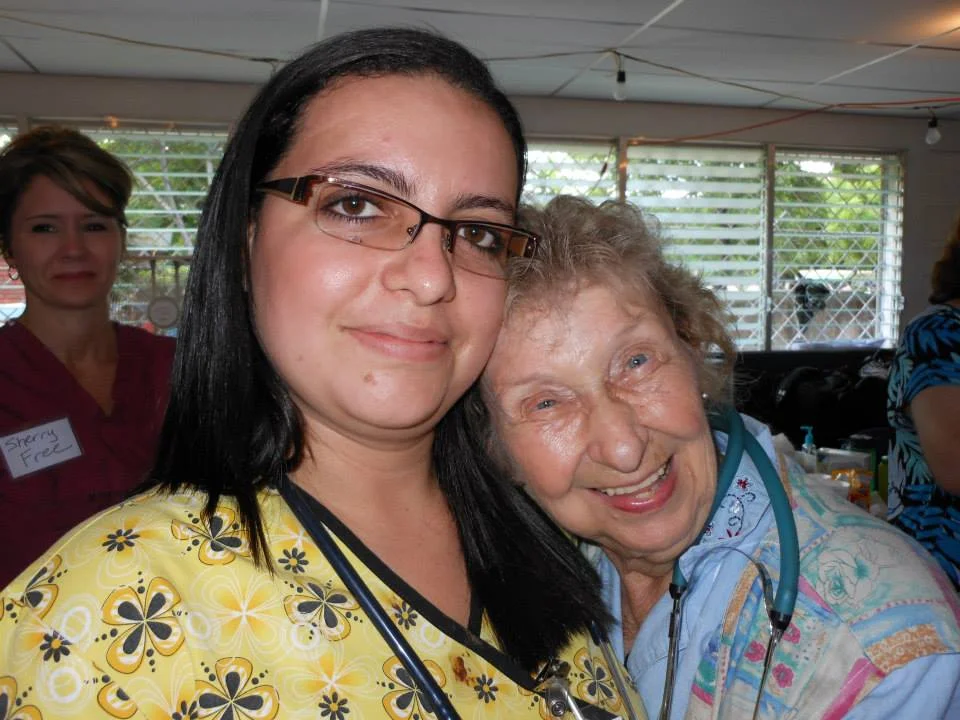 Dr. Karla Escalante hugging a patient.