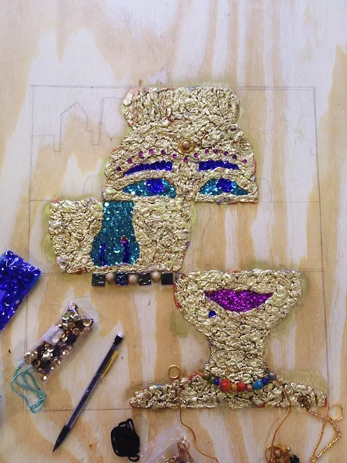 gum, spray paint, sequins, beads, wood.