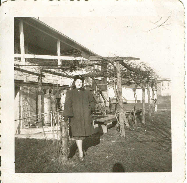 rosalie carbone standing by the grape arbor entrance to carb.jpg