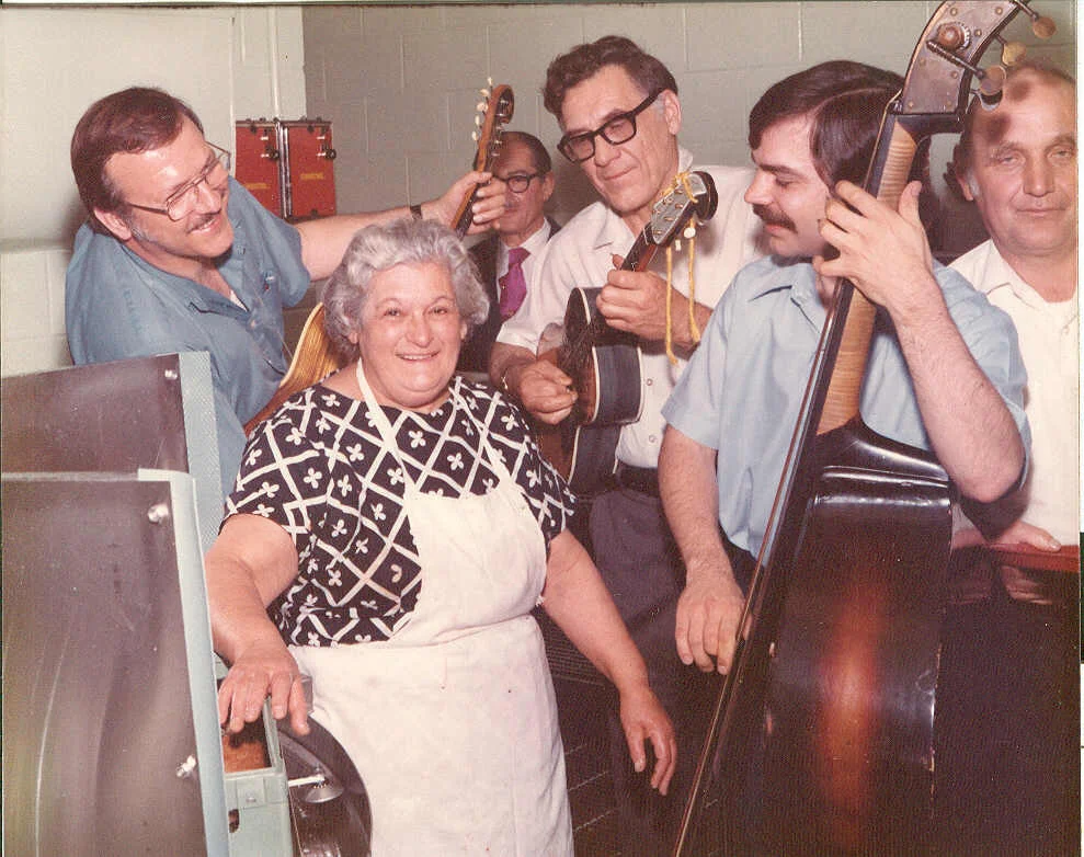 mary vernino getting serenaded while working in the dishroom.jpg