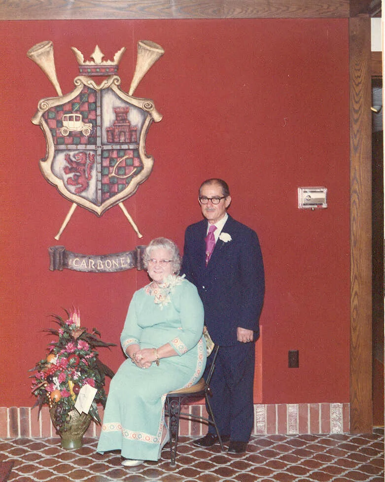 nat and mary carbone with the carbone's restaurant crest at .jpg