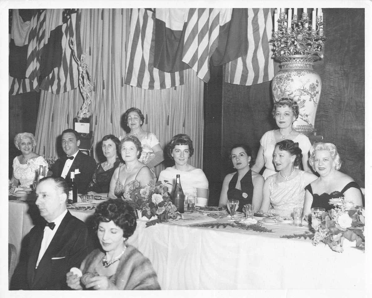 natalie mangini, seated in the center, receives the amita aw.jpg