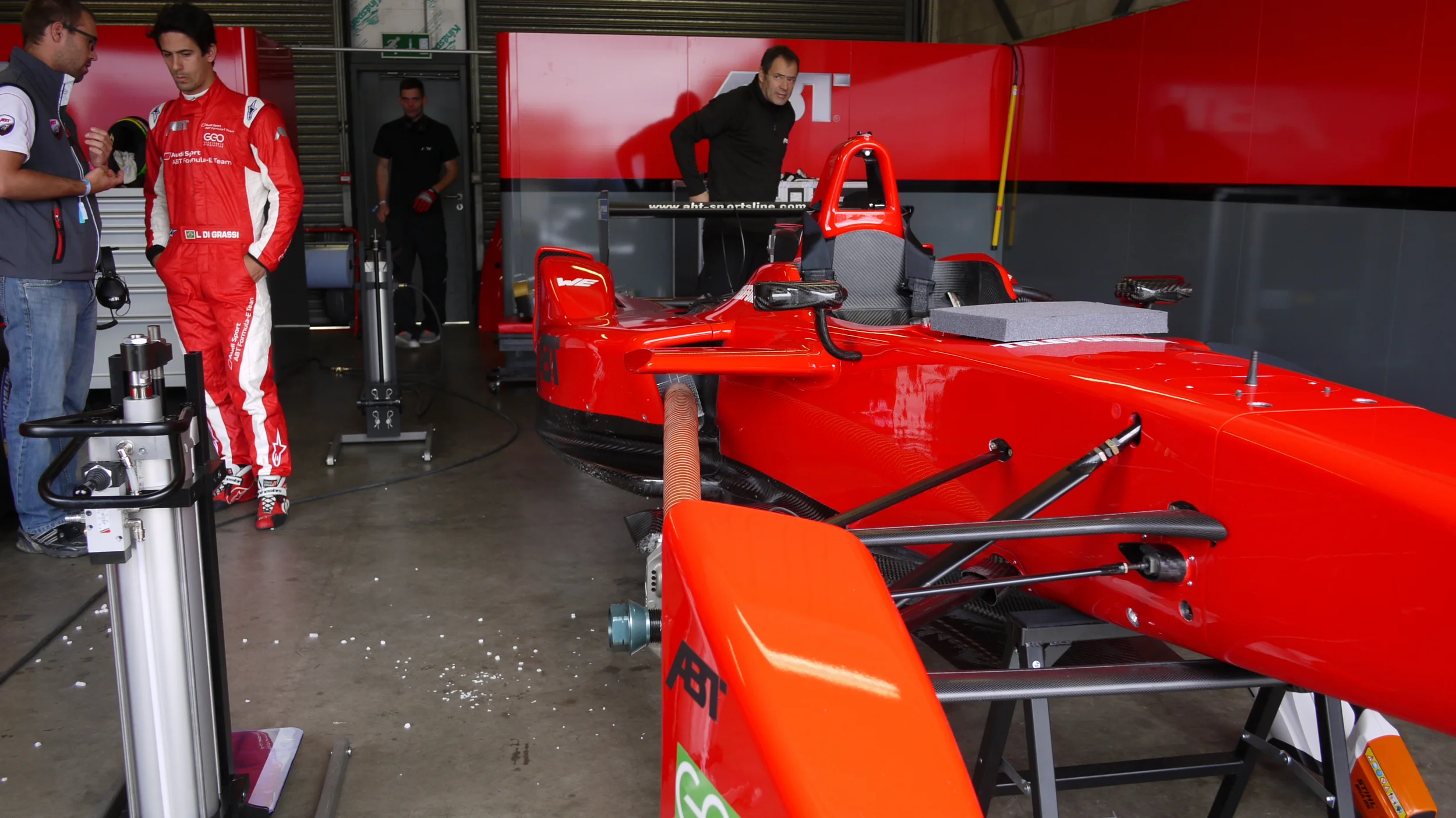 Audi Sport Abt sporting a fine "Leaf blower -> Hose -> Chip Basket of Dry Ice Pellets" cooling setup. White pellets on the floor are dry ice.