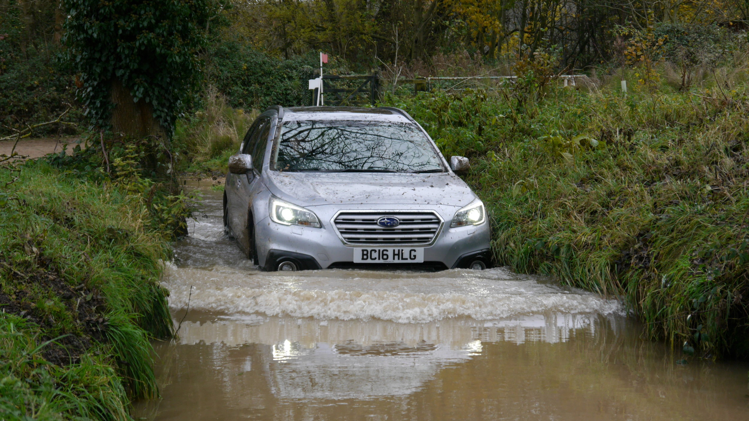 Andrew narrowly avoids planting a Subaru Outback in a riverbank. From the river.