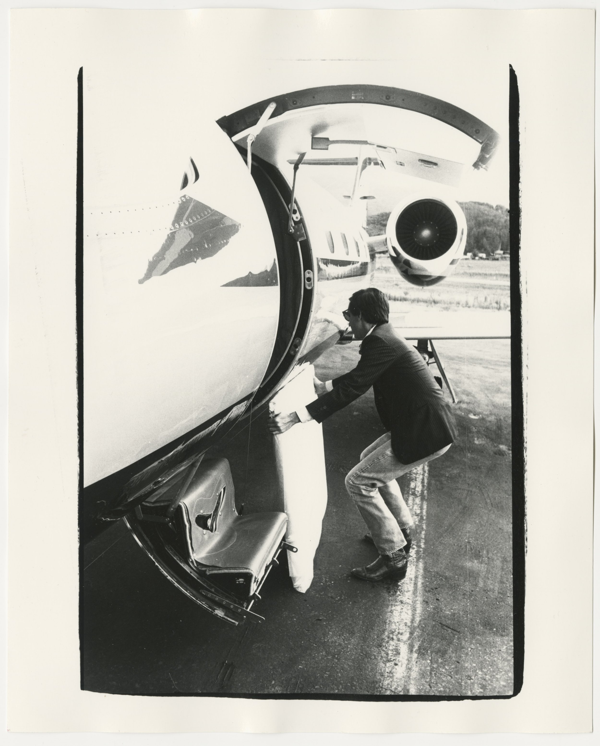 FL05.02075 Fred Hughes Loading a Warhol Painting onto a Learjet 35.jpg