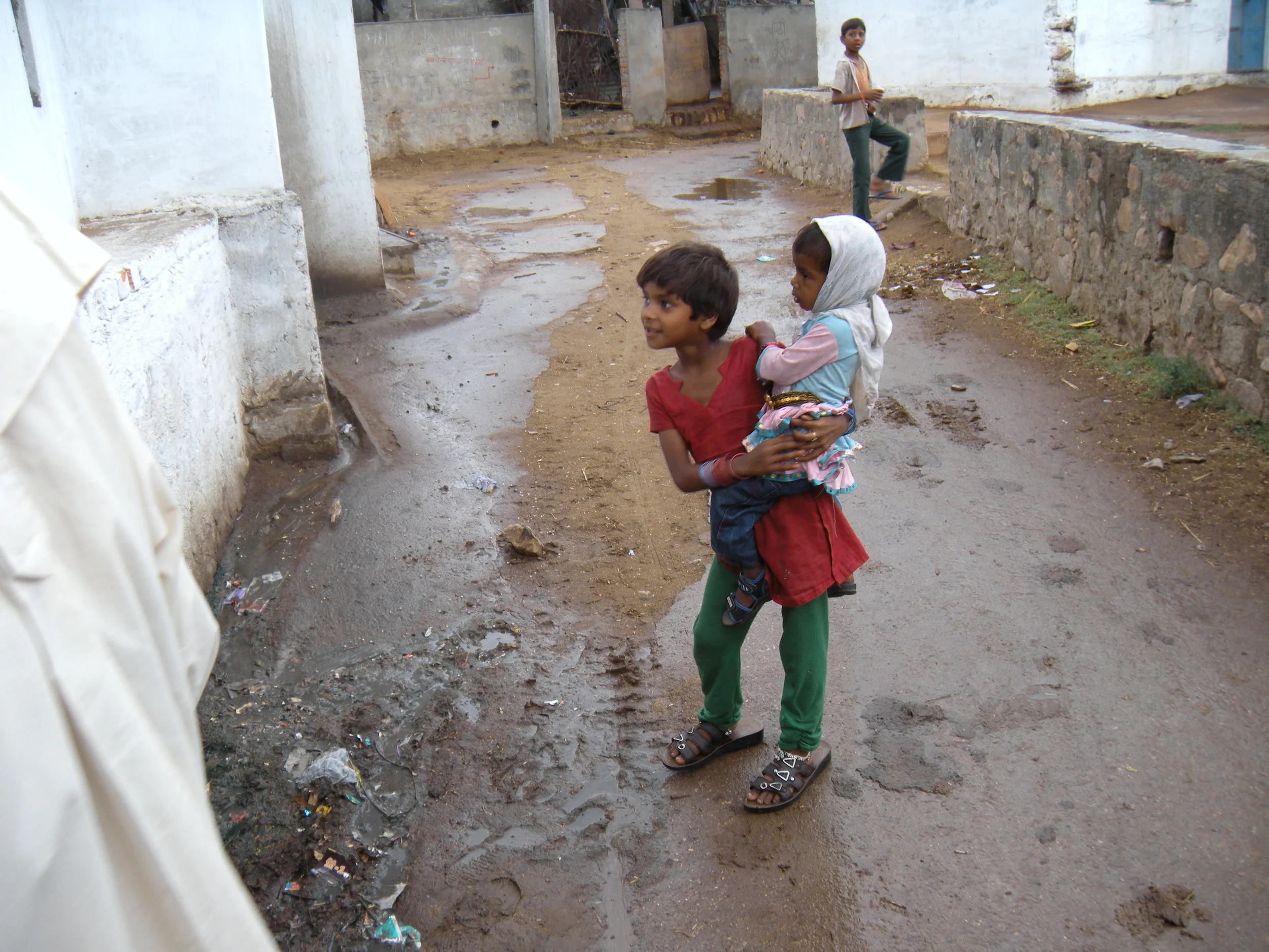 Girl and her sister in a small Indian village.