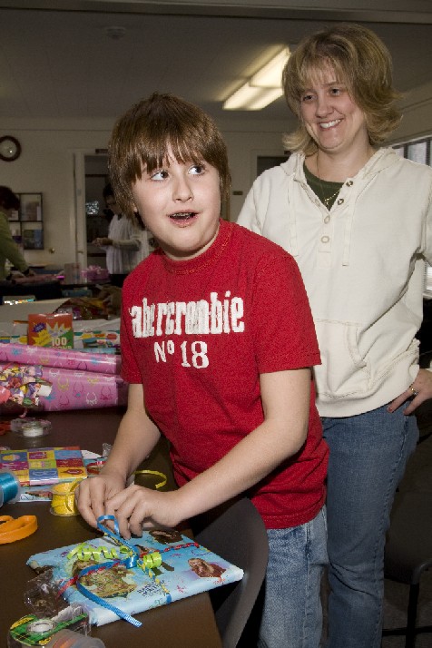 Church members of all ages enjoy wrapping gifts for children served by the Children's Birthday Project.
