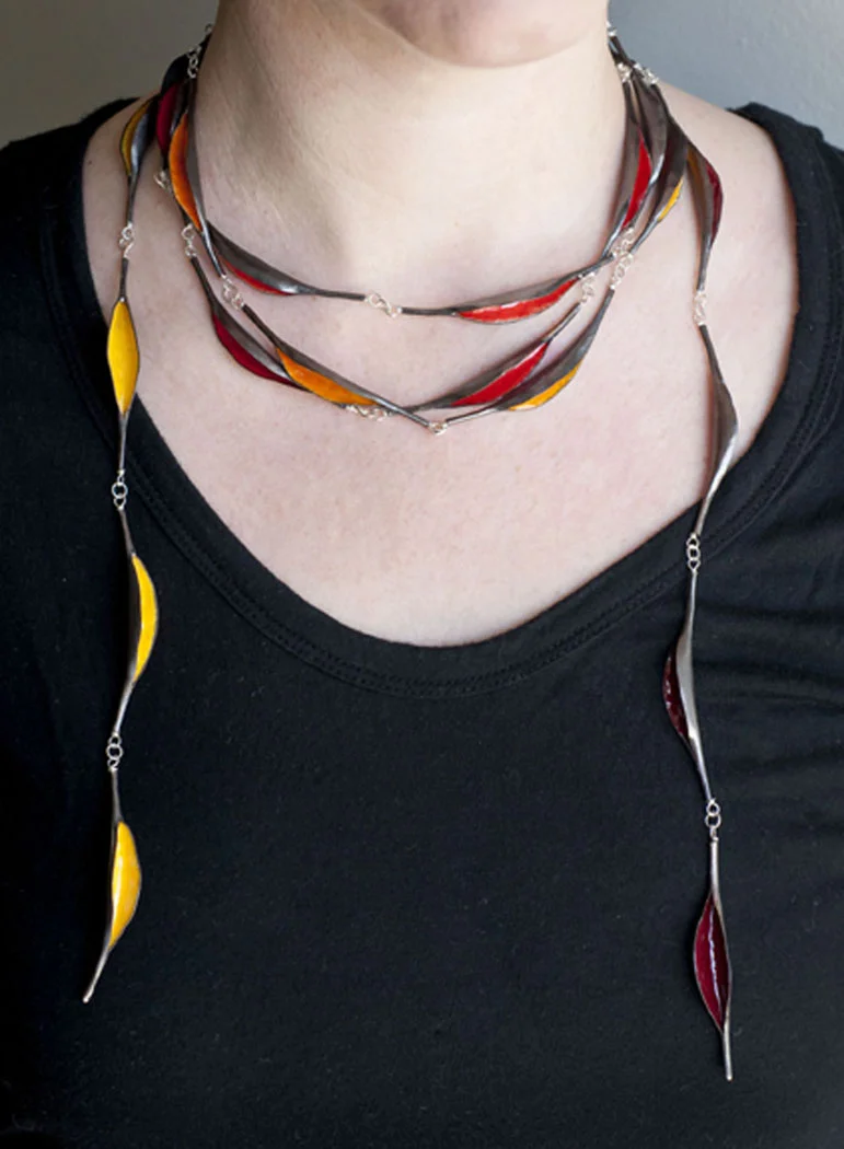Progression Neckpiece, 2013 Materials: copper, enamel, sterling silver, forged copper neckwire Size: Pods each ~3” long, entire chain consists of 28 pods and is over 5 feet long, meant to be wrapped around the neck and layered 2-3 times. Retail Price: $1250.00 *This piece has sold.