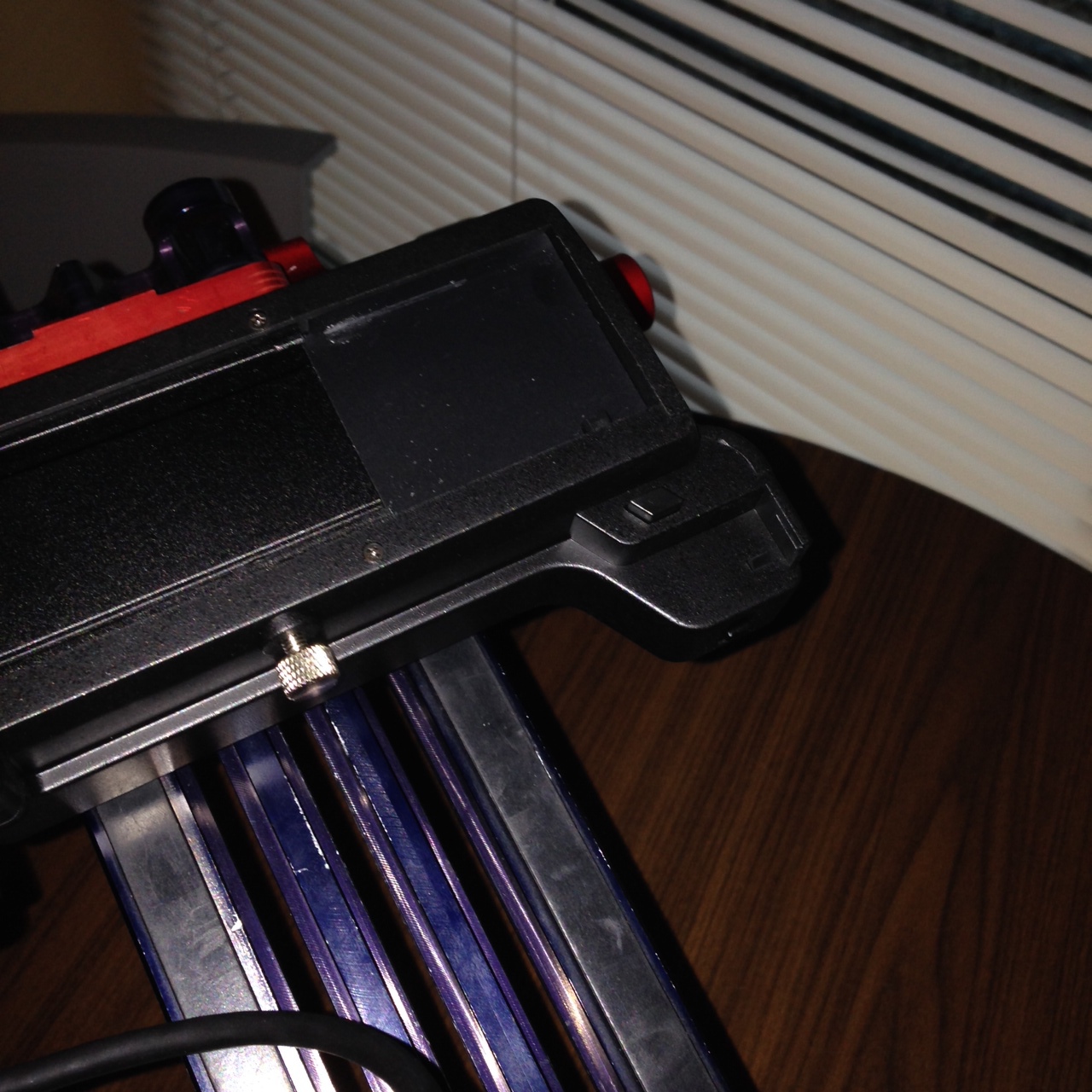 To mount the camera, slide from right to left and tighten the silver screw in the center.