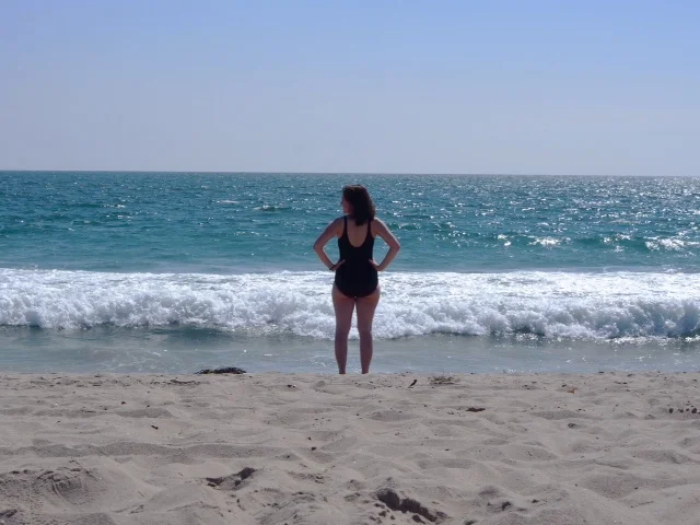 Me in my granny swimming suit, trying to work up the courage to get in the cold water.
