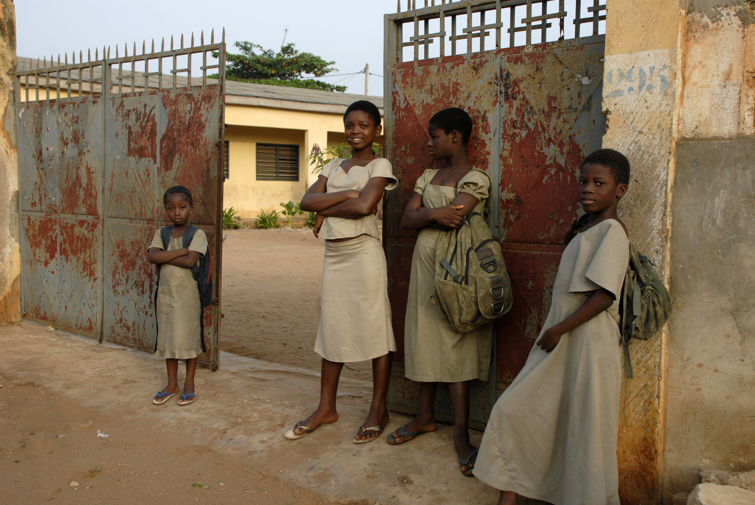  Students wait outside the Tokoin-Gbonvie elementary school in Lomé, Togo. 