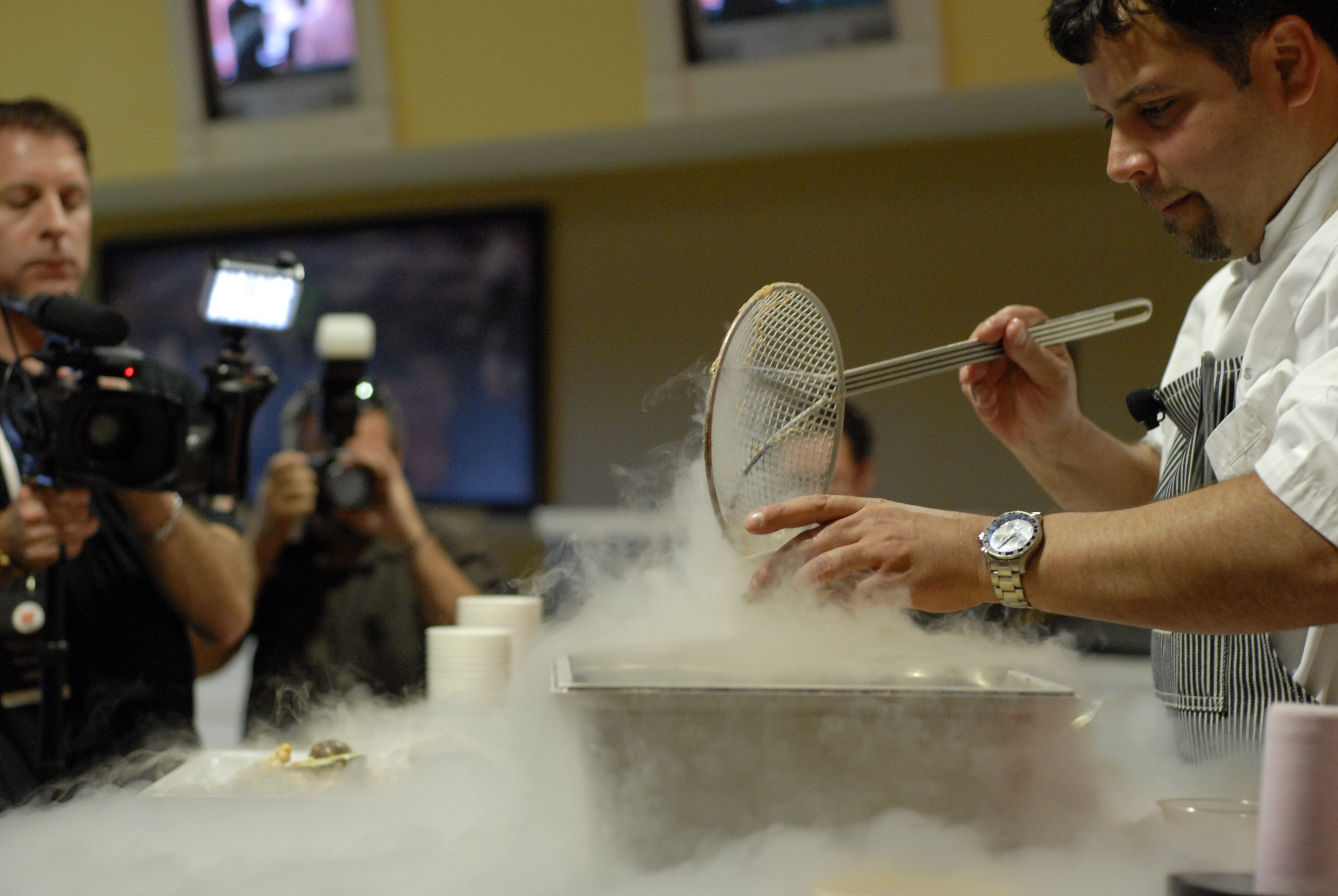  At Idea Festival's Taste of Innovation, Chef Anthony Lamas of Seviche serves caramel popcorn frozen in liquid nitrogen. 