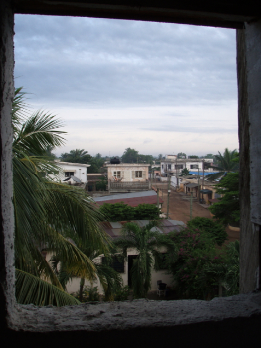 View out the window of a bathroom at Mammy's hostel in Lome, Togo