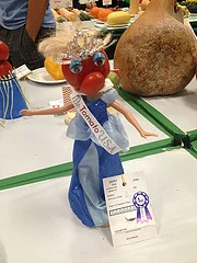 This is a beauty queen made from a tomato. 