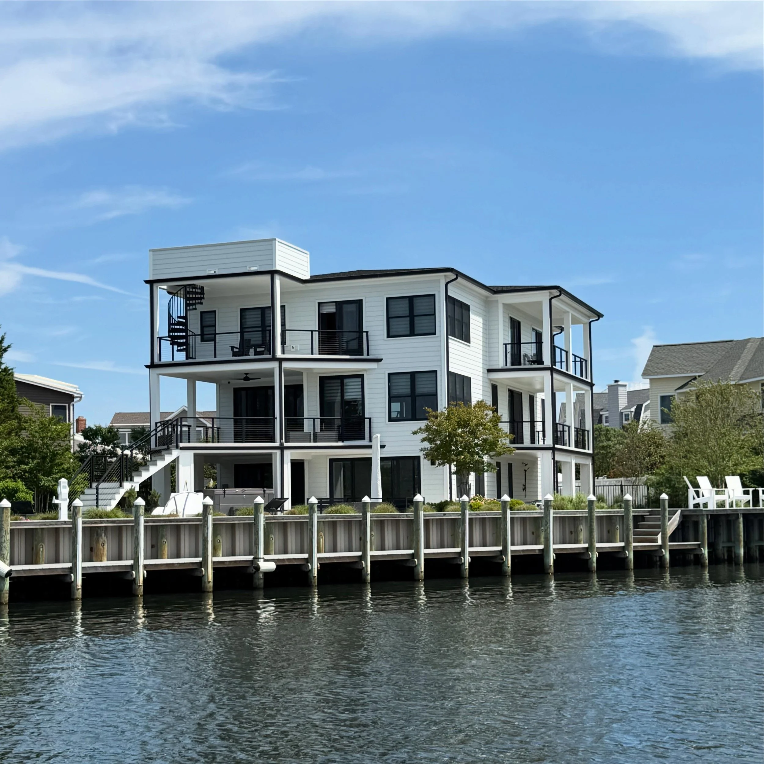 Views from the water of one of our favorite coastal builds. 🌊☀️ Whether your existing beach house is ready for a modern revamp or you&rsquo;re dreaming of building a coastal masterpiece from the ground up, we&rsquo;re here to bring your vision to li