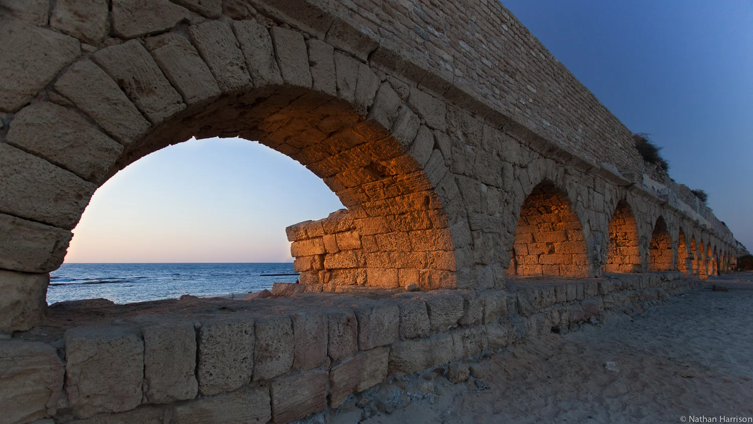 Aqueduct of Caesarea The Aqueduct brought running water to the old city of Caesarea, along a raised aqueduct. The source of the water was the springs of Shummi, 10KM away. Herod build the aqueduct in the 1st C BC. later, in the 2nd C AD it was expanded by the Romans. Later, 2 more aqueducts were built.