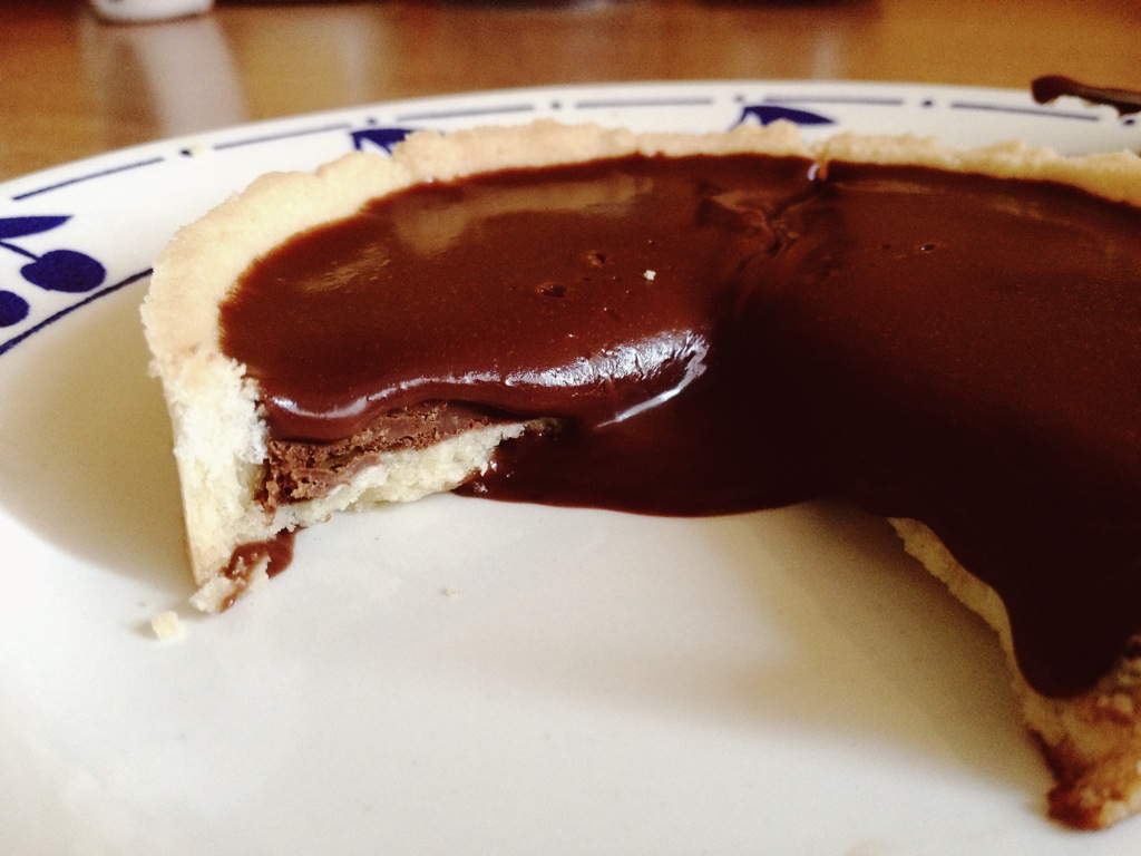 Top with glaze ganache. If I had bothered to wait another hour it wouldn't be hemorrhaging chocolate like this. 