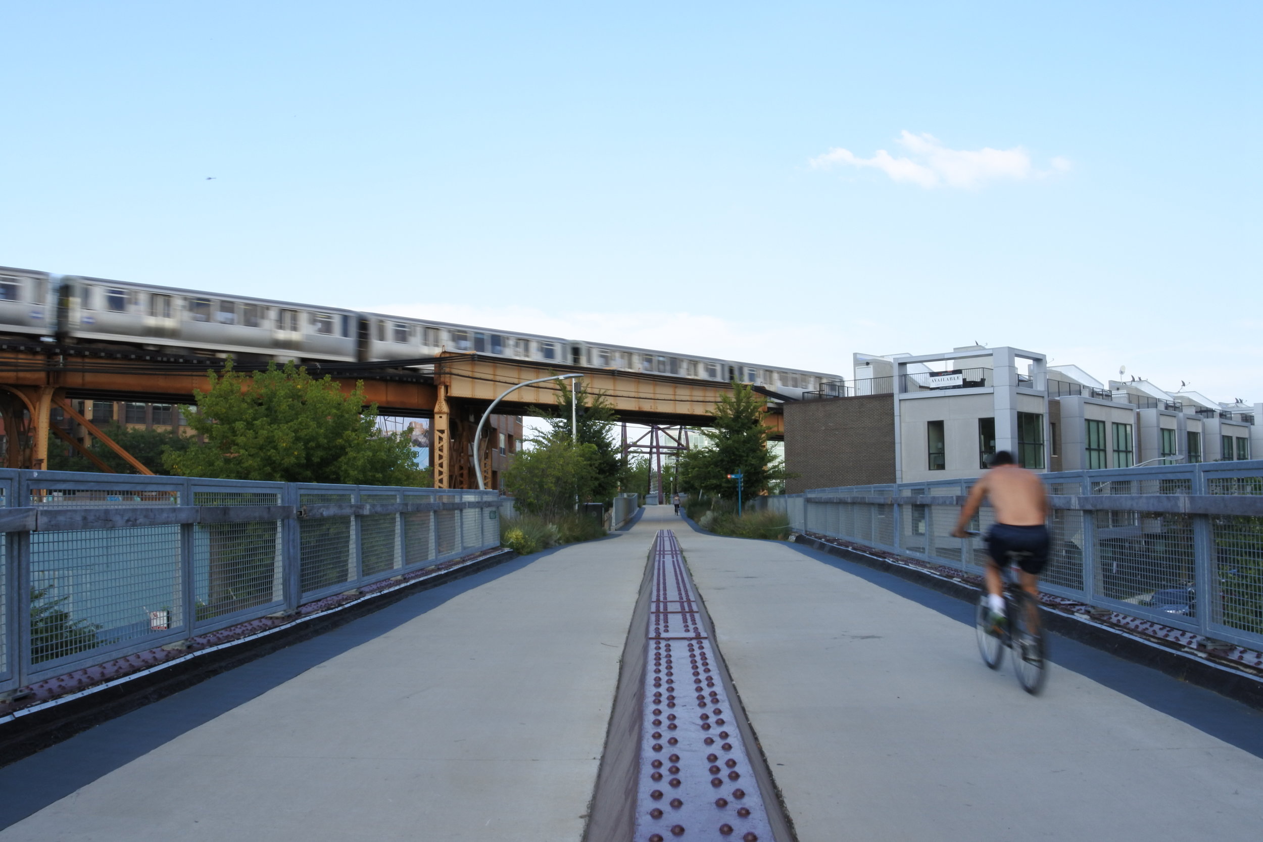 A biker on the 606, a former railroad line converted to public park.