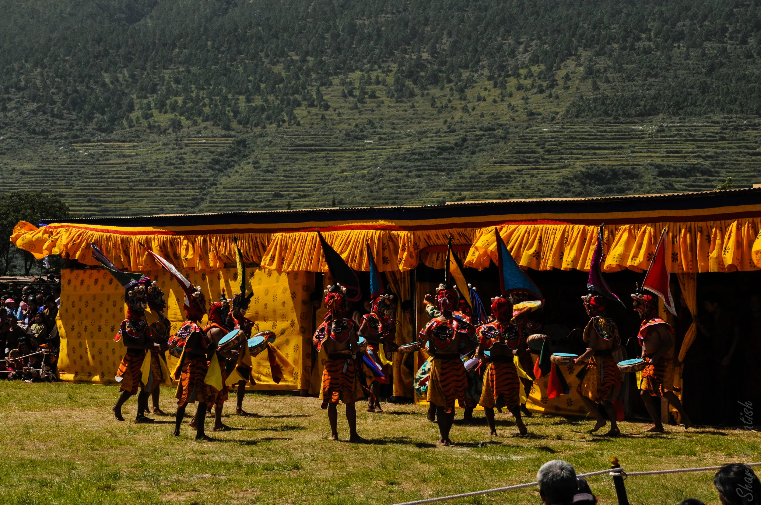 Dancers take the stage to perform as part of the opening Tsechu