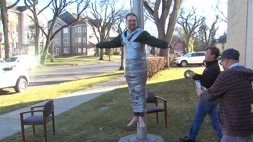 Staff Duct Tapes News Director to Flag Pole
