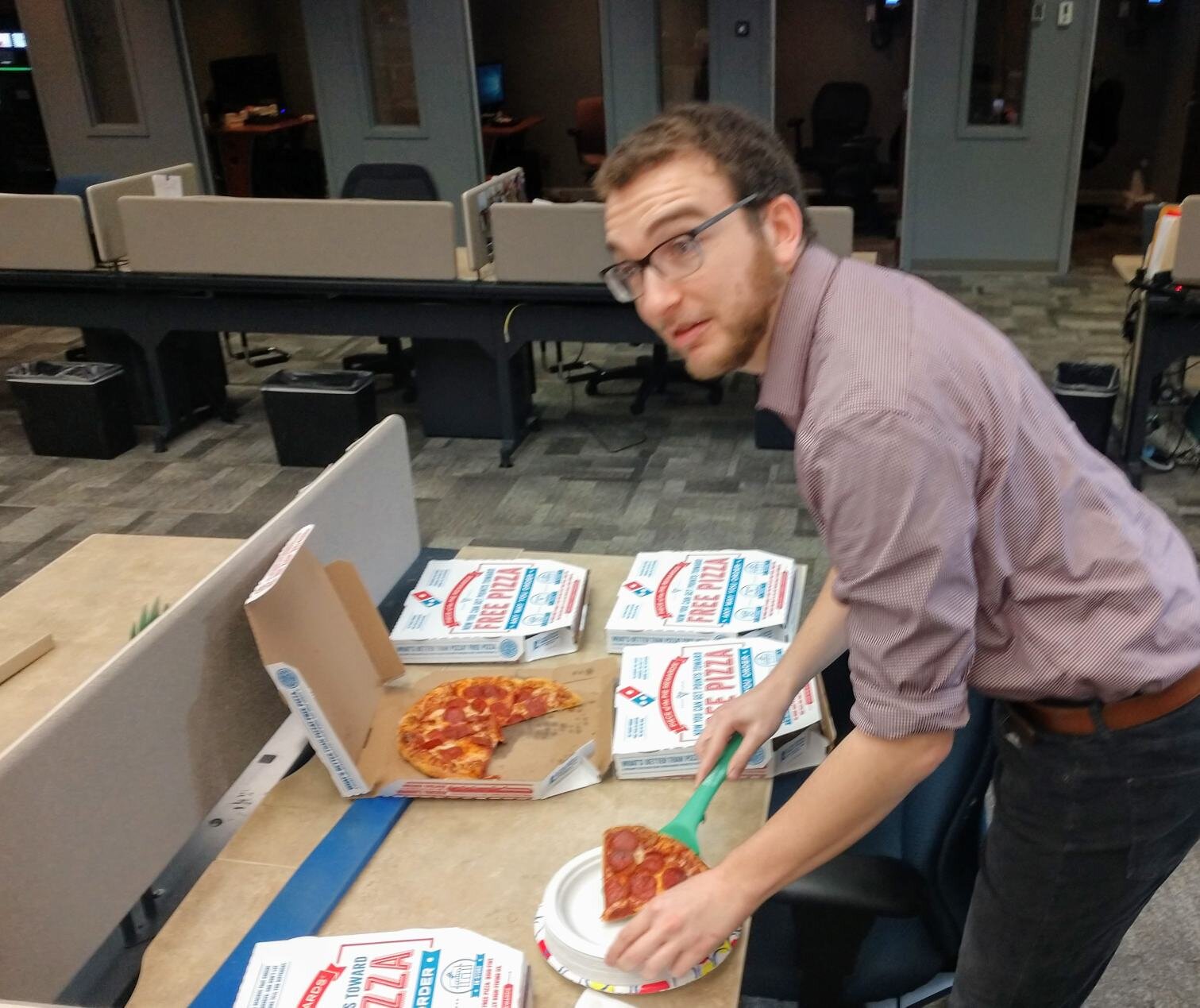 WRIC staffer digs into free pizza