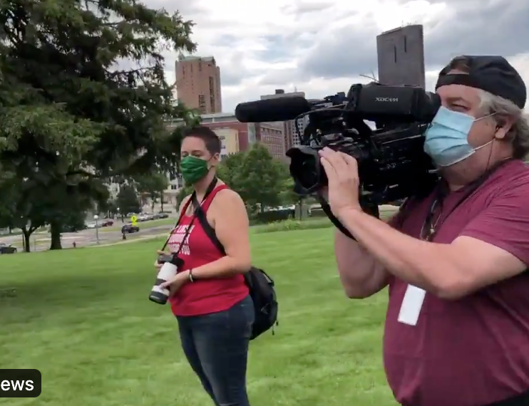 News Crew Escorted to Safety 