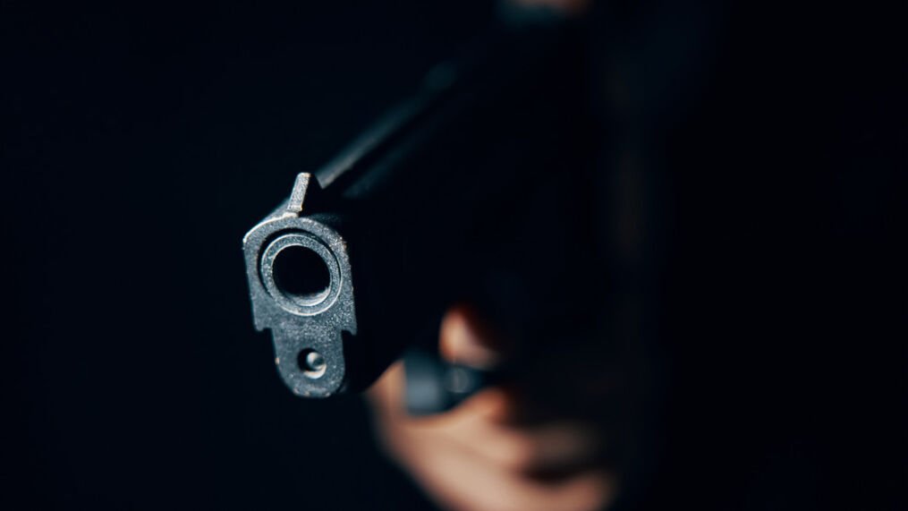 Gun Pointed at News Crew 