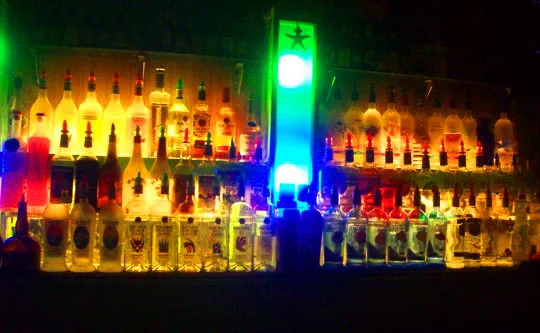 6. litupbottlesbehindbar_dec31.jpg