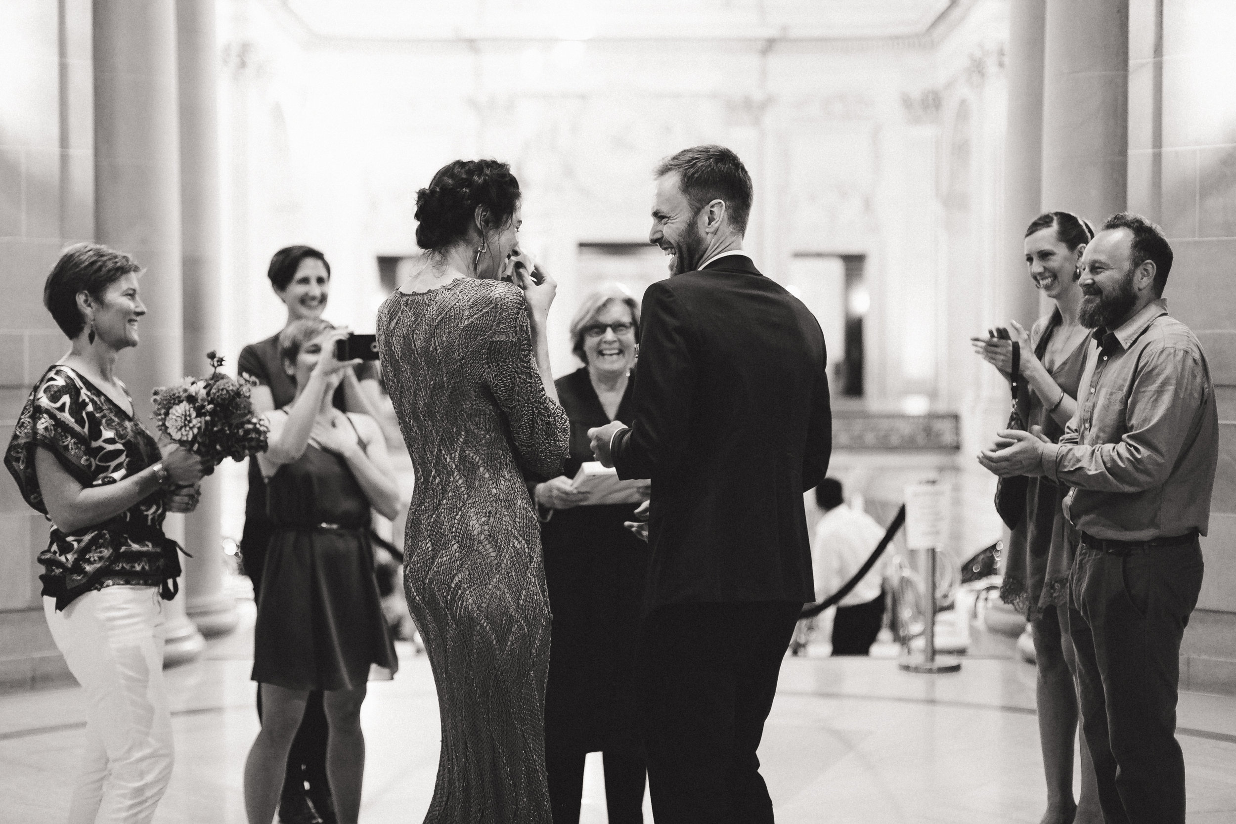  An intimate San Francisco City Hall ceremony, featuring an alternative bride in a bright orange dress. 