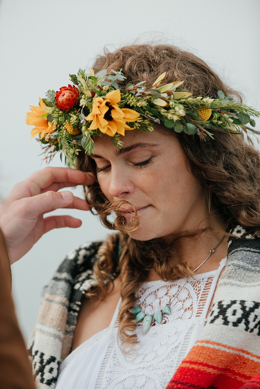 A bride cries during wedding ceremony