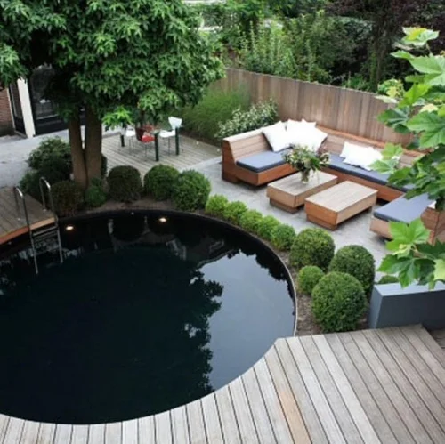 Topiary shrubs create a neat, manicured aesthetic.