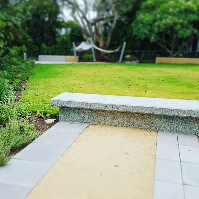 Concrete bench in garden #seedlandscapedesign #structureinlandscape
