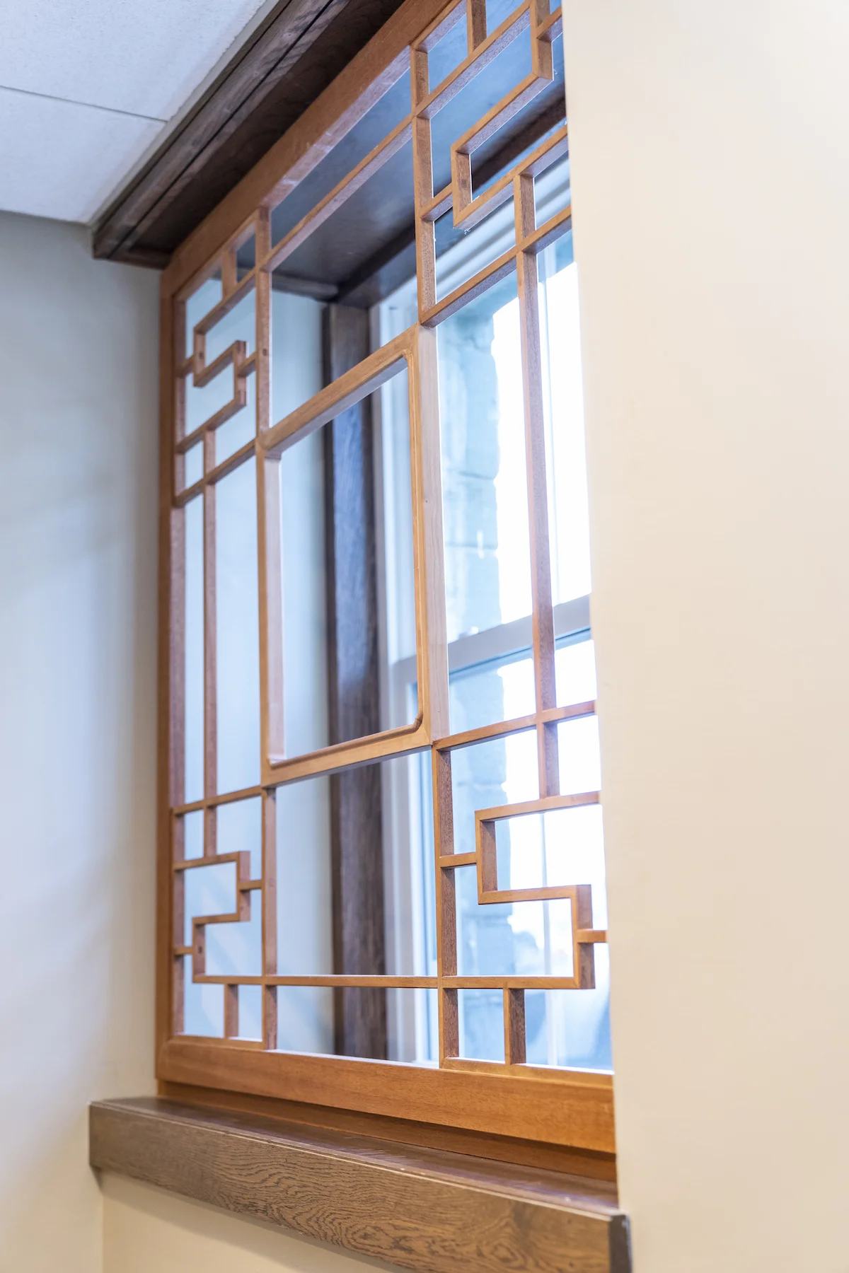 Mahogany outer frame and lattice, with American Black Cherry inner window frame.