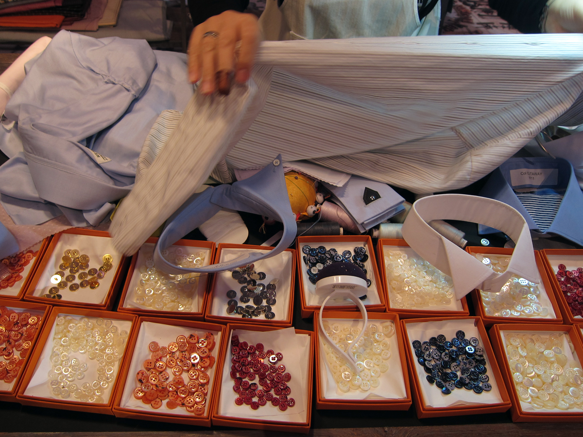  The shirt makers variety of colored buttons. 