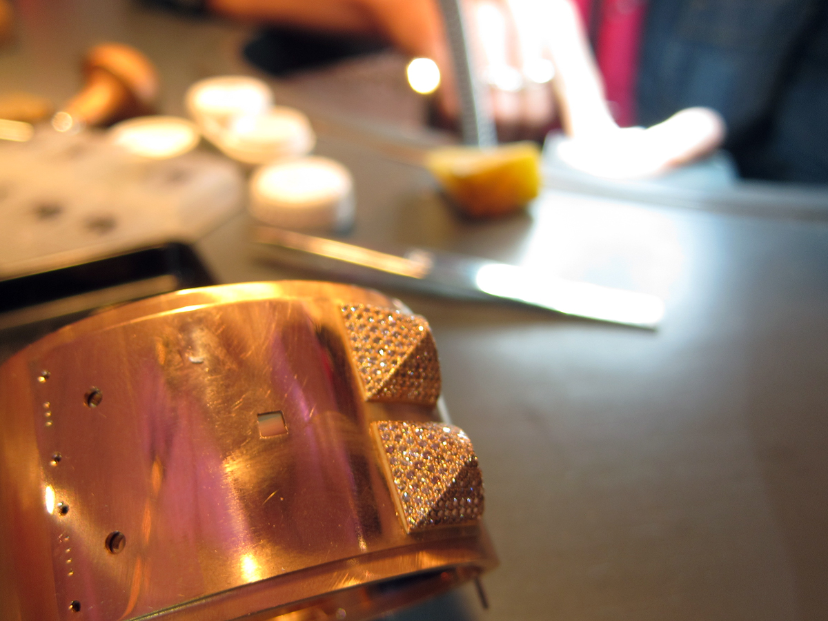  A rose gold studded cuff with two of the four pave diamond studs attached. 