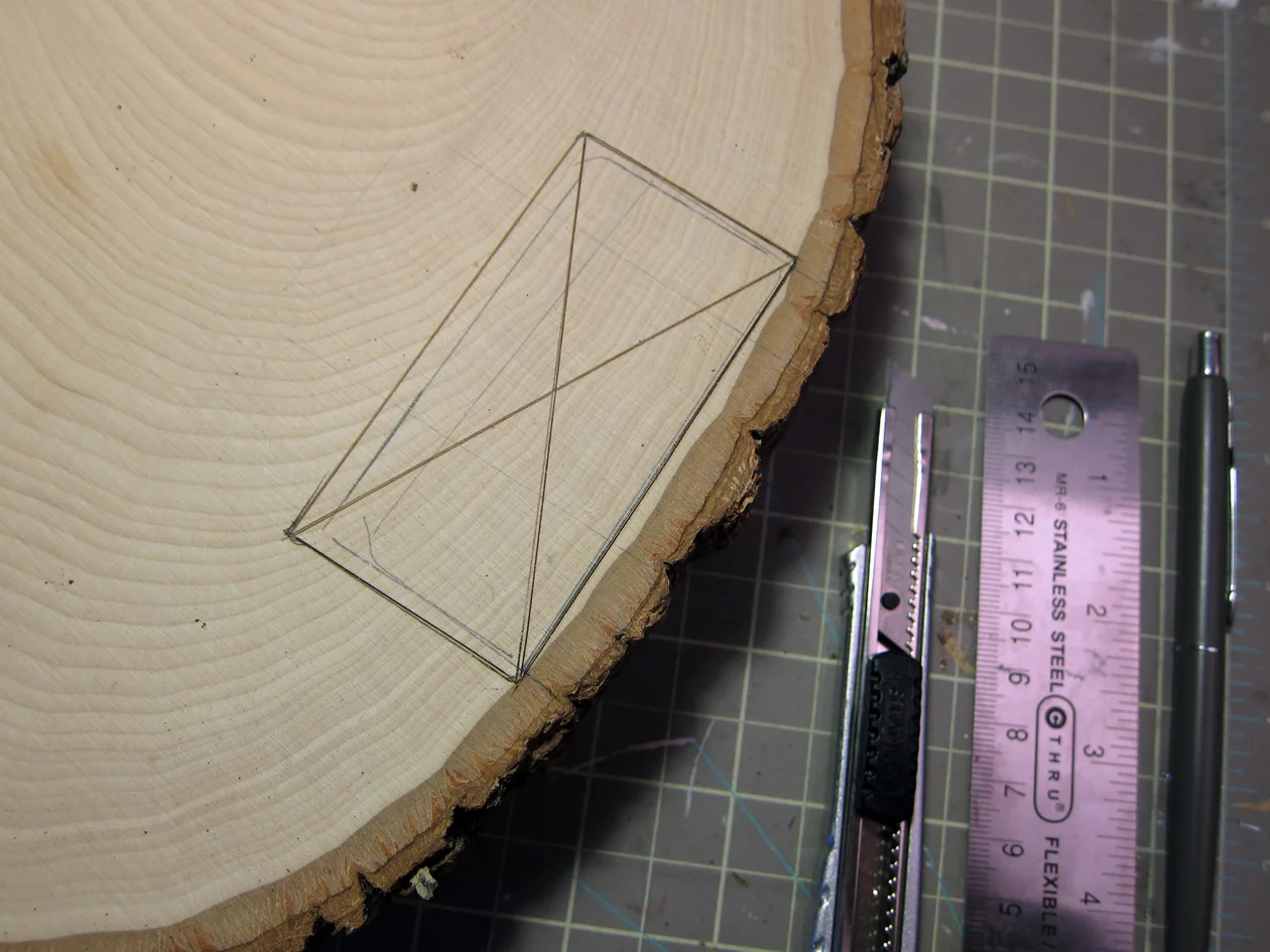 Make a chisel guide, slightly bigger than the tracing, using a utility knife and ruler.