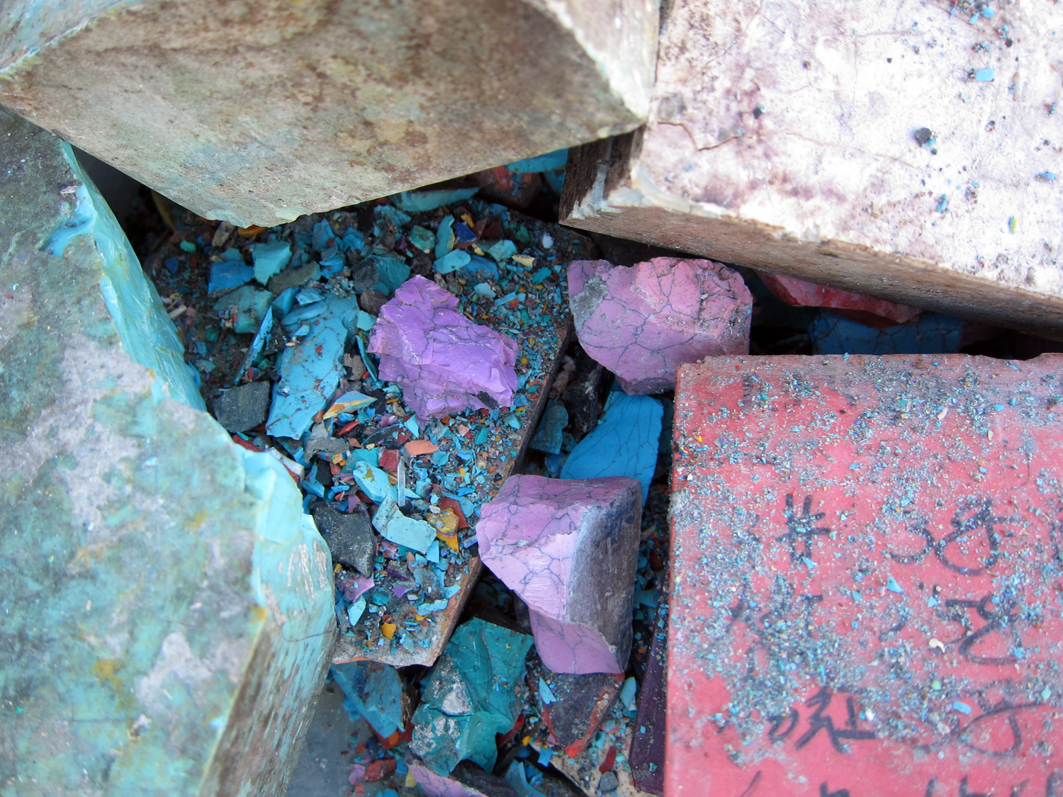  ​Broken bricks—chromatic pieces, vivid dust. 