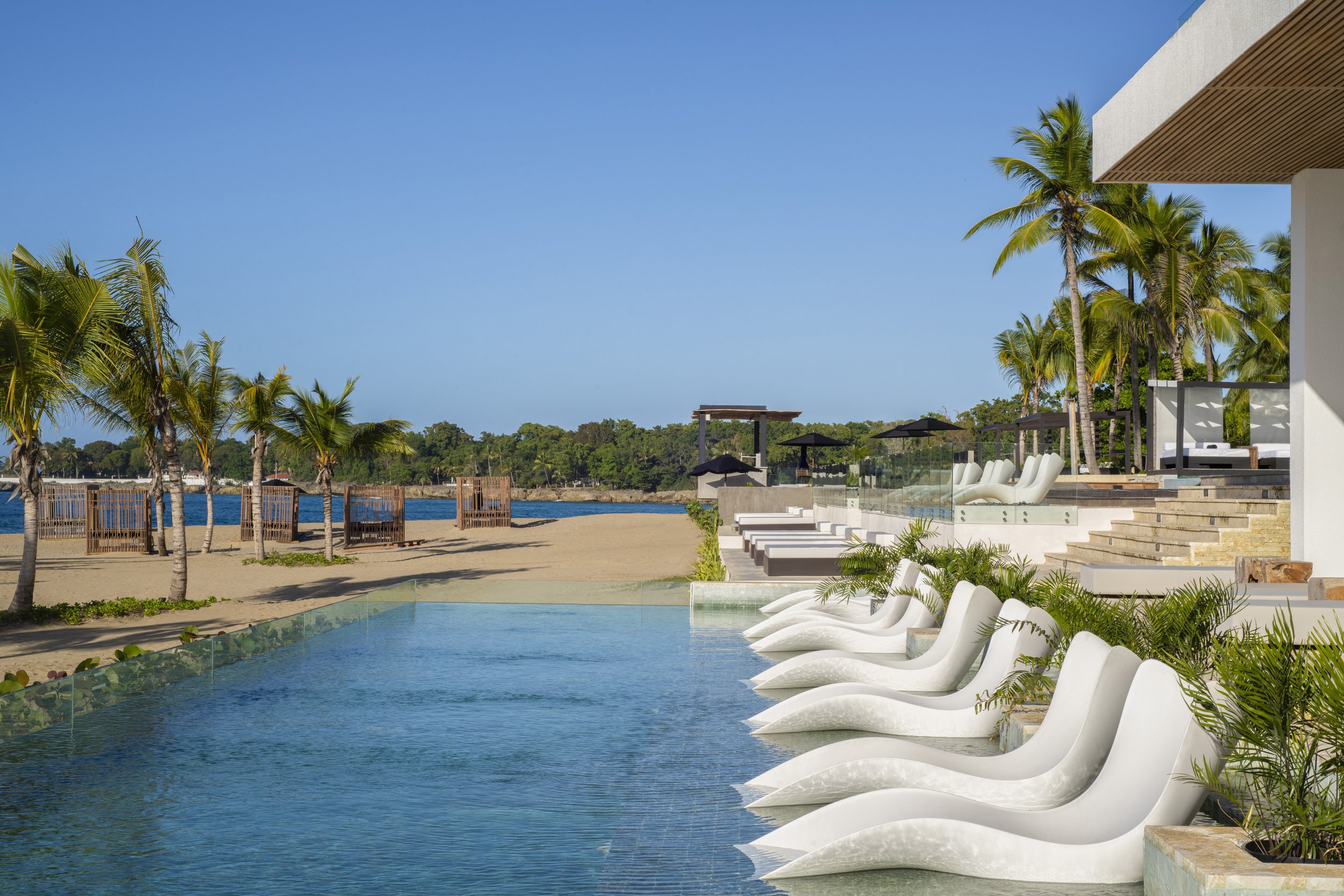 beach pool area of the ocean club costa norte by marriott in the dominican republic.jpg