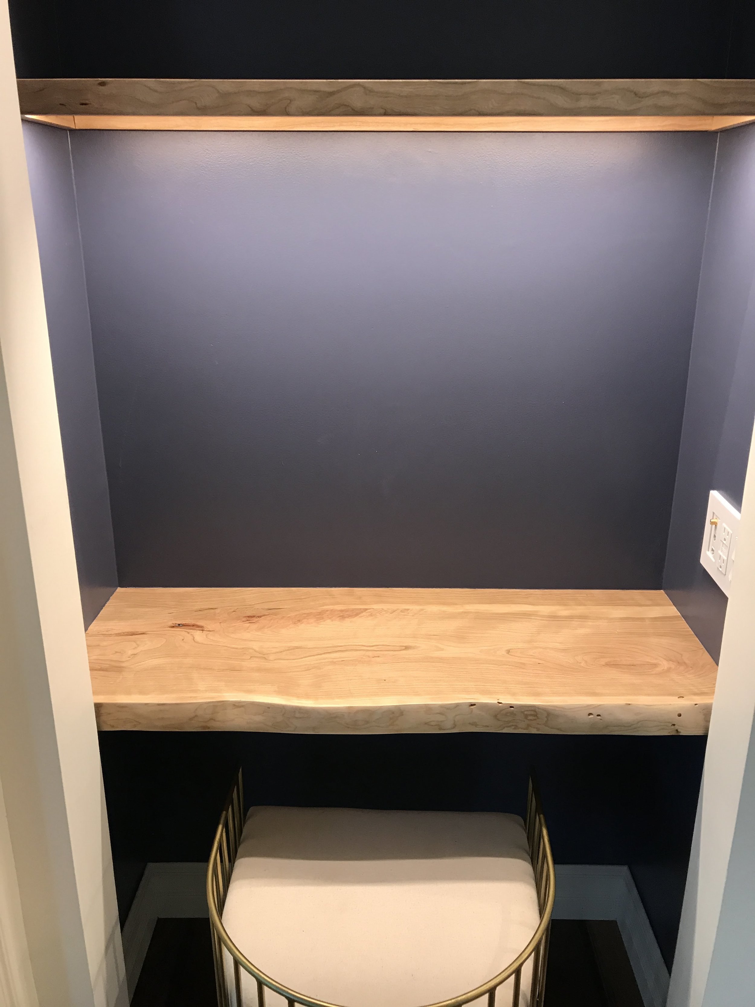  Writing nook with a custom, live edge, cherry slab desktop and energy-efficient, low profile LED lighting above. 
