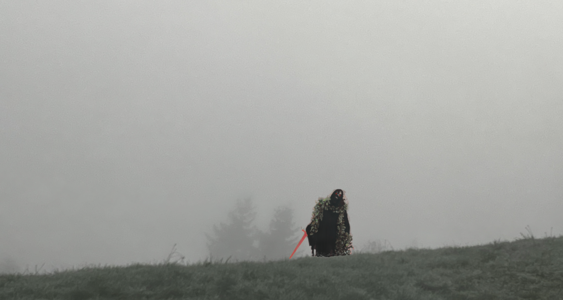 dark figure on a foggy hill