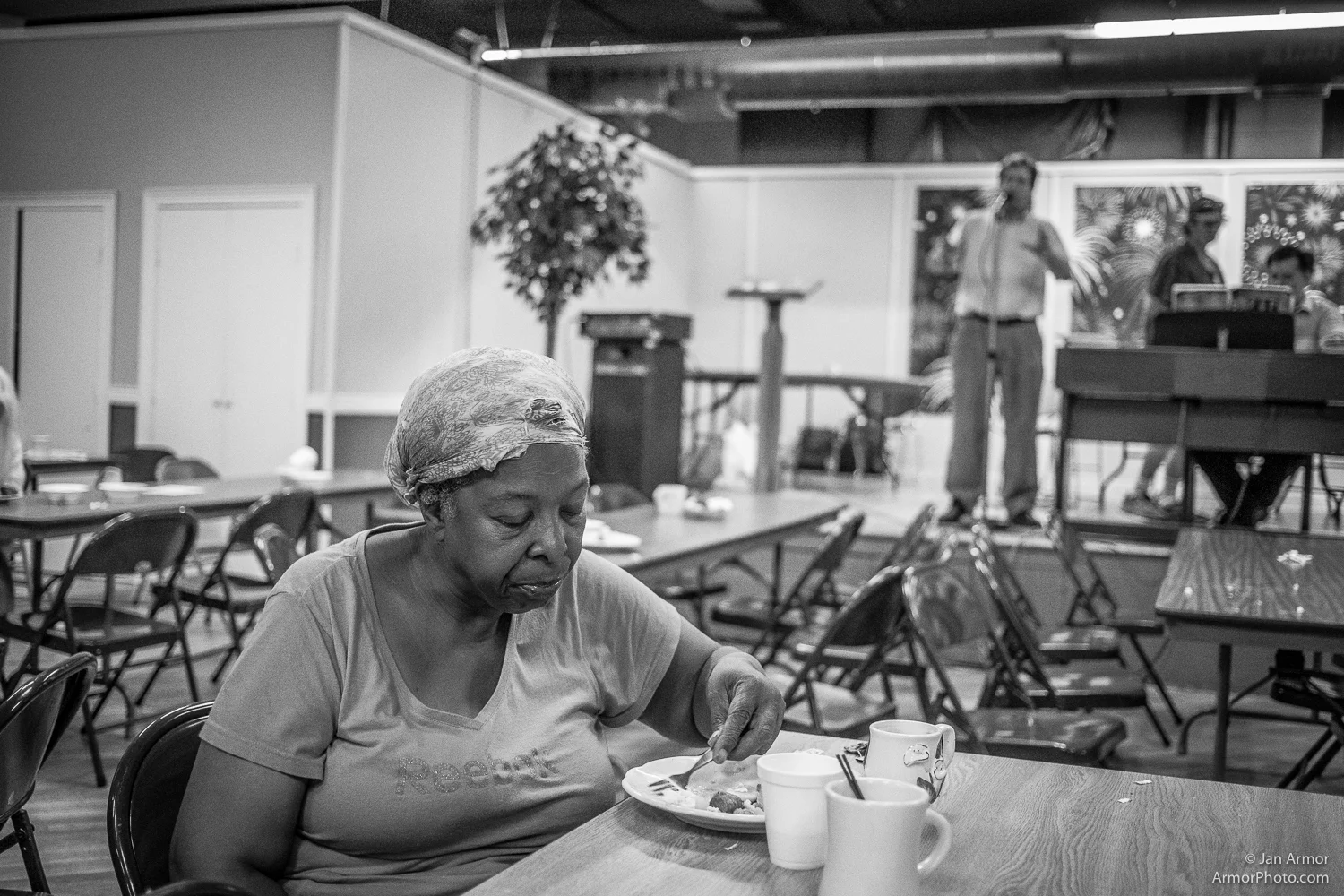 She came to the Breakfast late, all alone, and spoke to hardly any one. She seemed preoccupied in thoughts, maybe of better times long long ago. To me she seemed to have given up, resigned to a life without laughter or promise. When I asked her name she just waved me away. It was very sad.