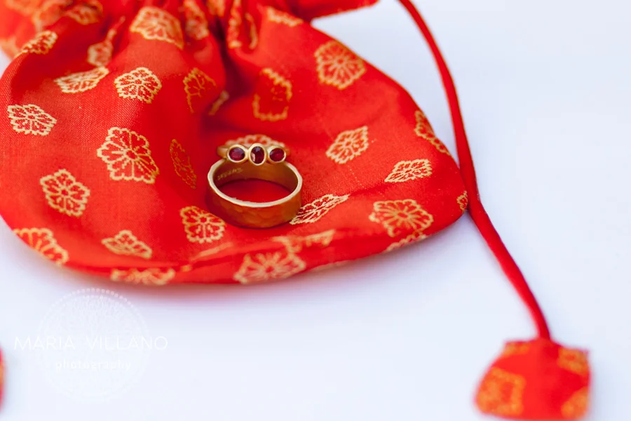 Wedding rings on red bag