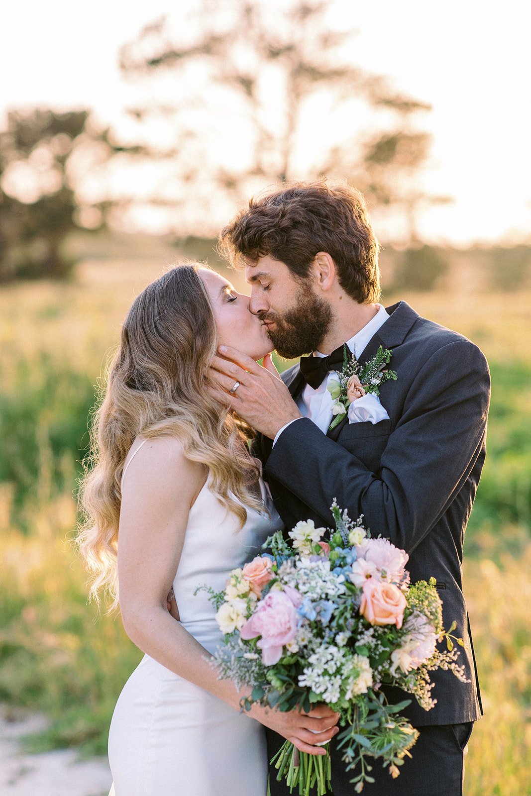 bride and groom kiss carmel