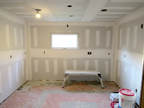  Kitchen with new drywall. 
