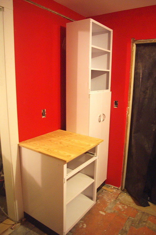  Broom closet and cabinet. The broom closet is set off the wall, to accommodate the plumbing going into the laundry room. &nbsp;This will be framed in so you can't see the gap. 