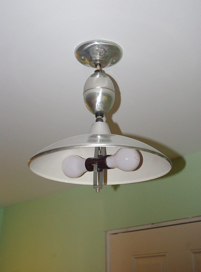 Our "new" vintage pull-down light. There is a curved glass diffuser which will cover the light bulbs, but we left it off so it doesn’t break during construction.