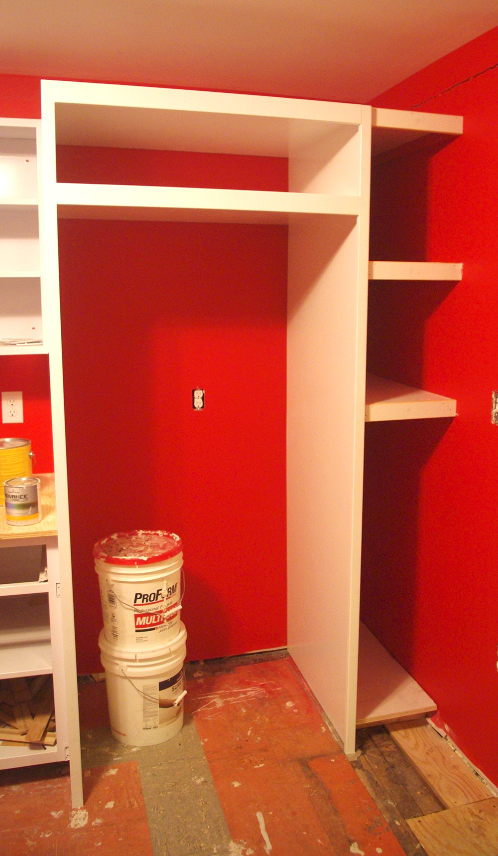 Our new fridge surround and shelves. The shelf above the fridge will eventually get doors and hardware to match the rest of the cabinetry.