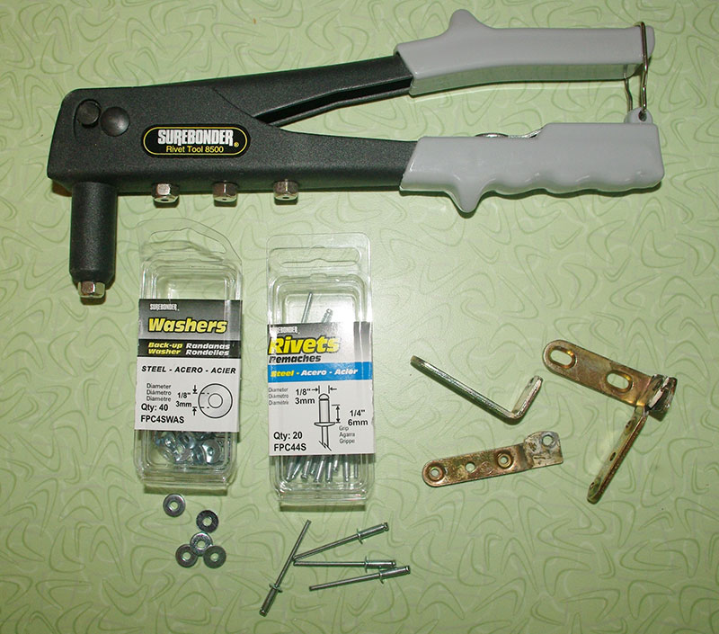 Tools required for fixing the hinges; Pop-rivet tool, washers and steel rivets. The broken hinges are shown in the lower-right.