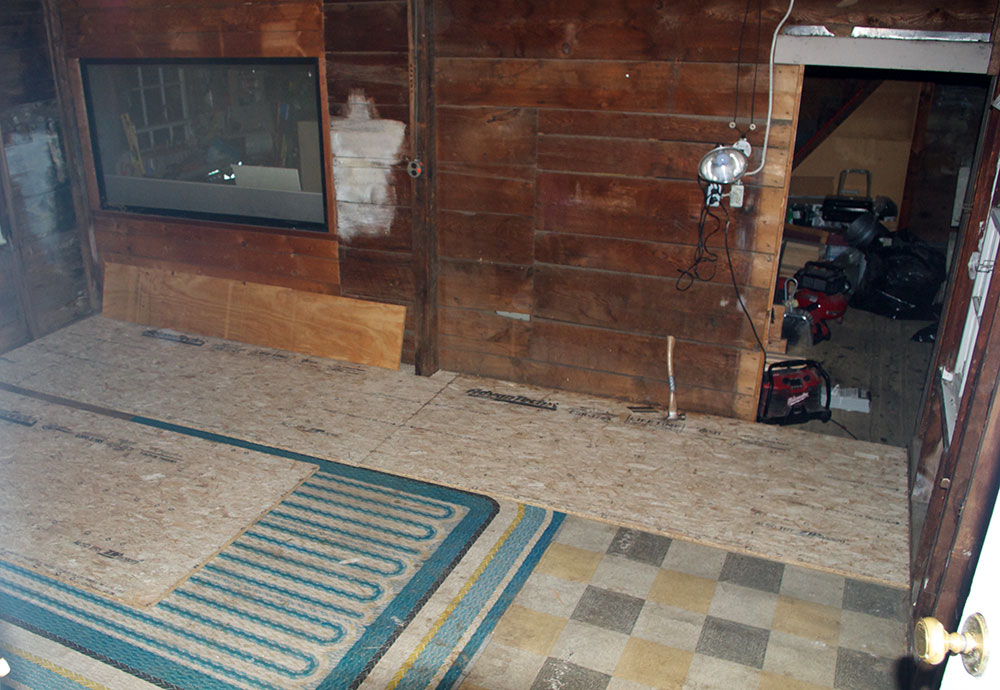 New sub-floor going down over the old linoleum. Someday, someone is going to find that treasure.