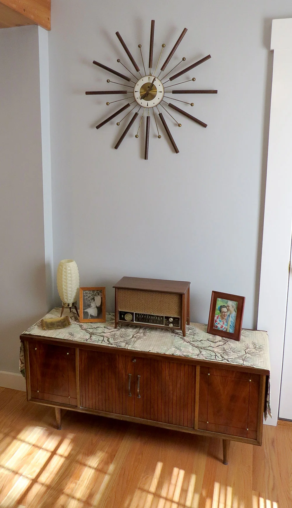 The starburst clock, from my sister, that inspired the mid-century modern look we decided to go for.